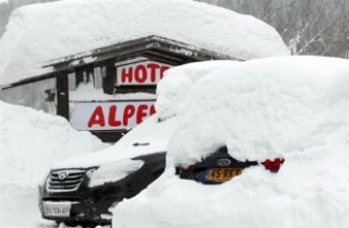 Cars covered with snow in St. Anton