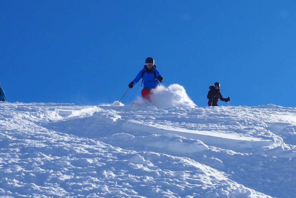 heli-skiing-bc-prices-going-down-mountain-min