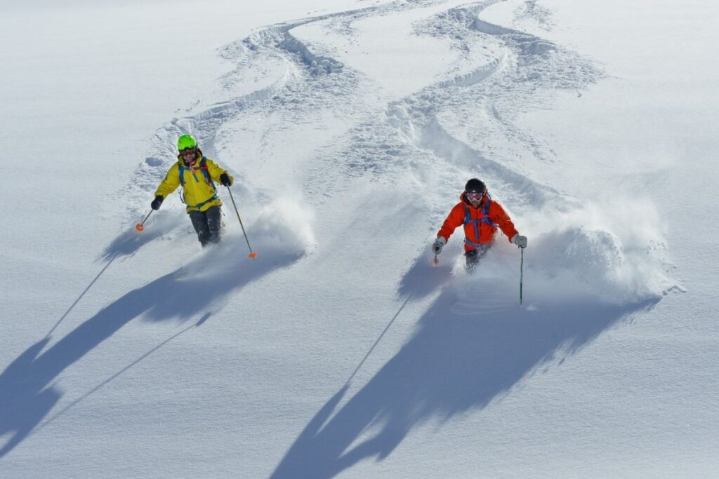 heliskiing-canada-prices-two-skiers-min
