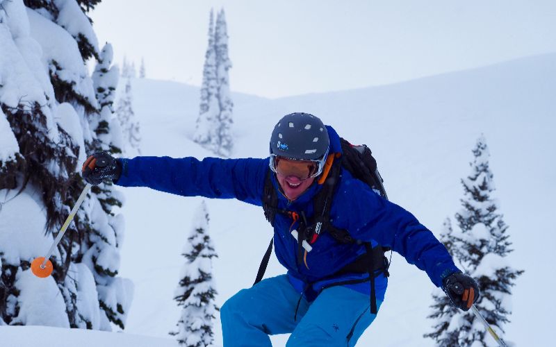heli-skiing-bc-prices-smiling-man-min