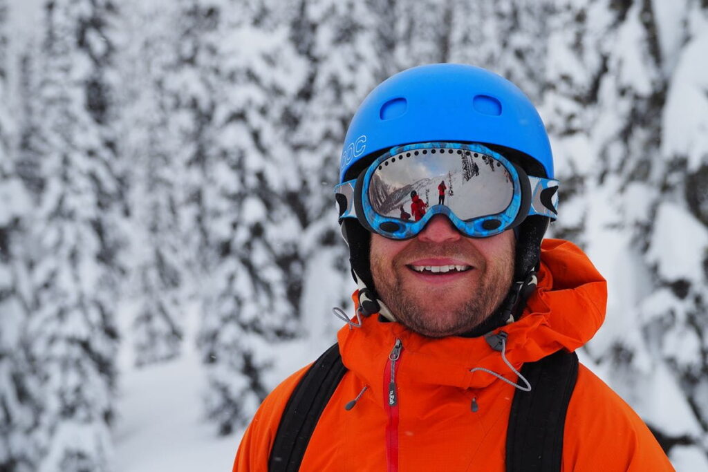 heli-skiing-bc-prices-man-standing-on-mountain