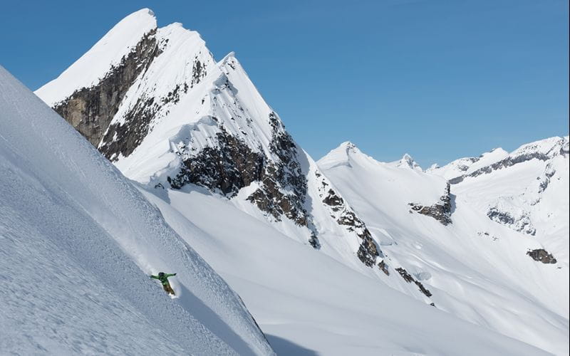 heliskiing-canada-prices-skier-going-down-mountain (1)
